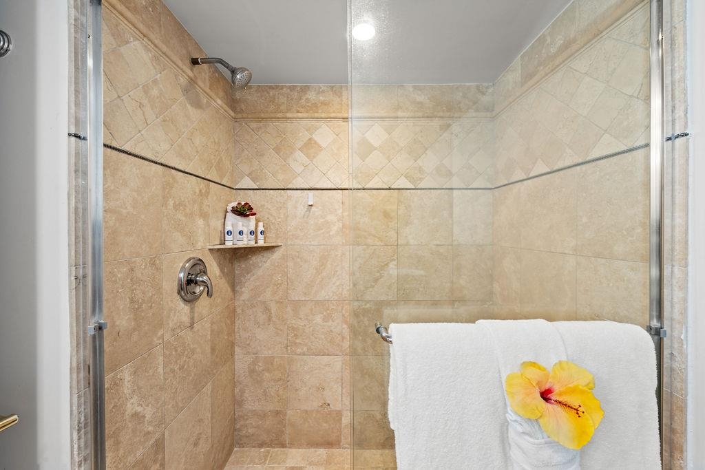3785 Lower Honoapiilani Road, Unit 208 Lahaina, HI 96761 - Photo 36 of 50 a bathroom with a tub and shower