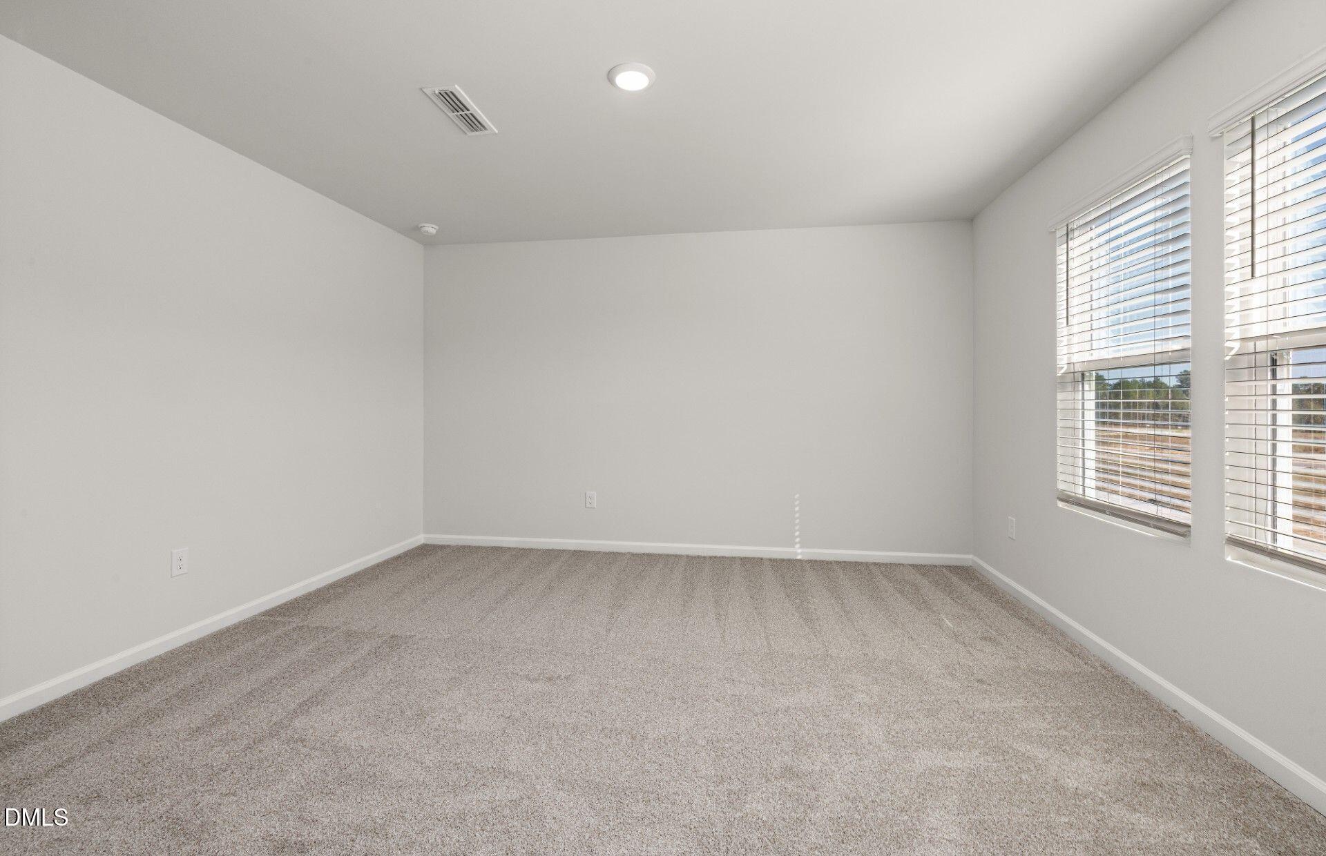 603 Timber Terrace Drive Durham, NC 27704 - Photo 10 of 17 an empty room with a window