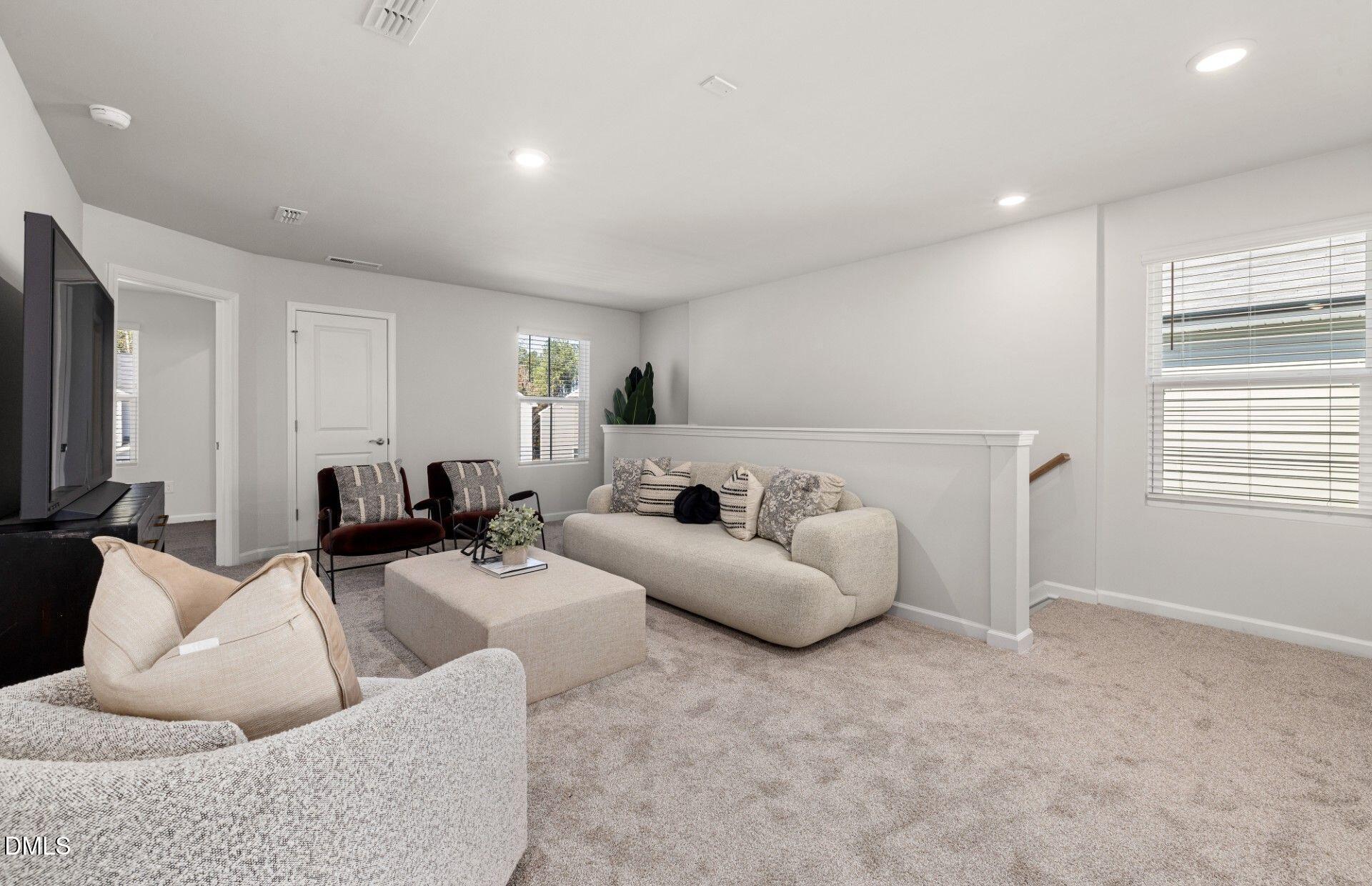 603 Timber Terrace Drive Durham, NC 27704 - Photo 12 of 17 a living room with furniture and a flat screen tv