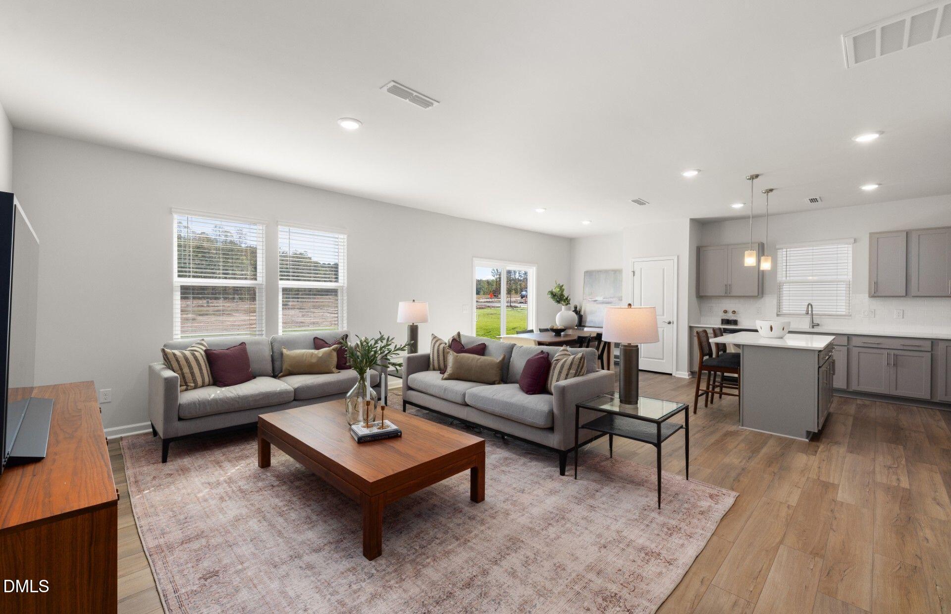 603 Timber Terrace Drive Durham, NC 27704 - Photo 6 of 17 a living room with furniture and a large window