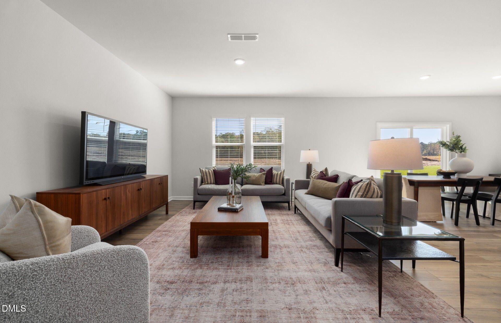 603 Timber Terrace Drive Durham, NC 27704 - Photo 7 of 17 a living room with furniture and a flat screen tv