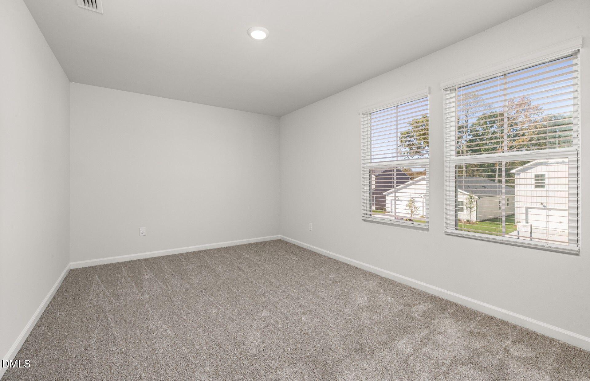603 Timber Terrace Drive Durham, NC 27704 - Photo 9 of 17 an empty room with a window