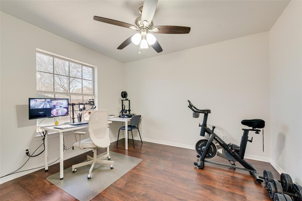 106 Villanova Circle Forney, TX 75126 - Photo 22 of 26 a view of a workspace with furniture and a window