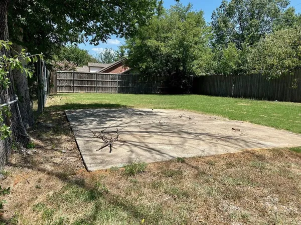 a view of backyard with green space