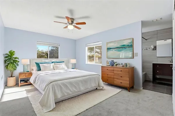 a bedroom with a bed and a dresser