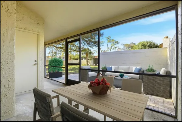 a view of a dining room with furniture and window