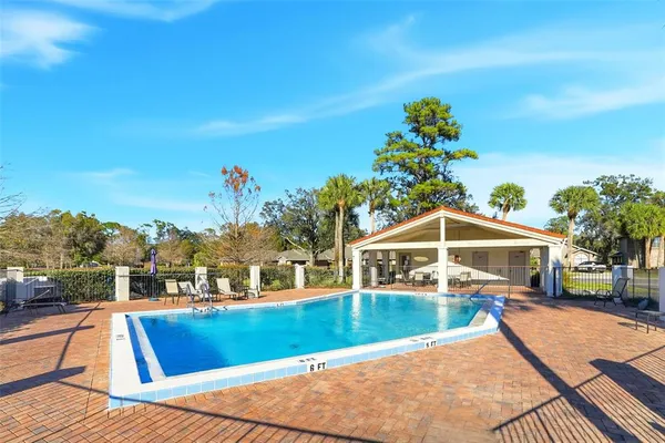 a view of a swimming pool with a patio
