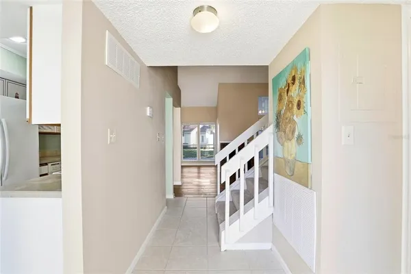 a view of a hallway with staircase