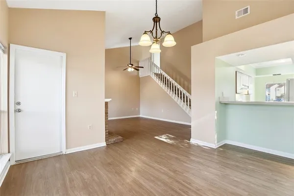 a view of livingroom with hardwood floor and stairs
