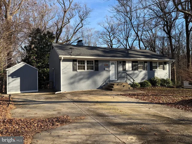a view of a house with snow on the road