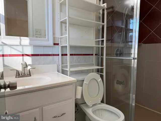 a bathroom with a toilet sink and shower