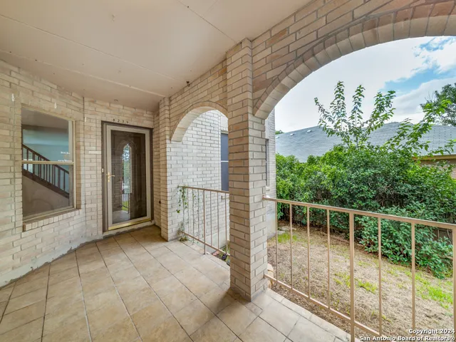 a bedroom with bed and window