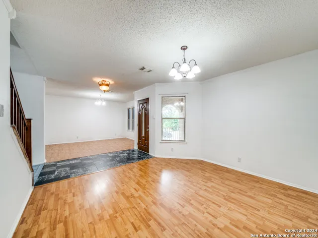 a kitchen with a stove a sink and a refrigerator
