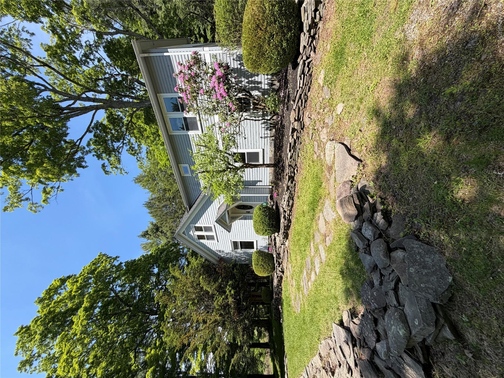 726 Wittenberg Road Mount Tremper, NY 12457 - Photo 3 of 32 a front view of a house with garden