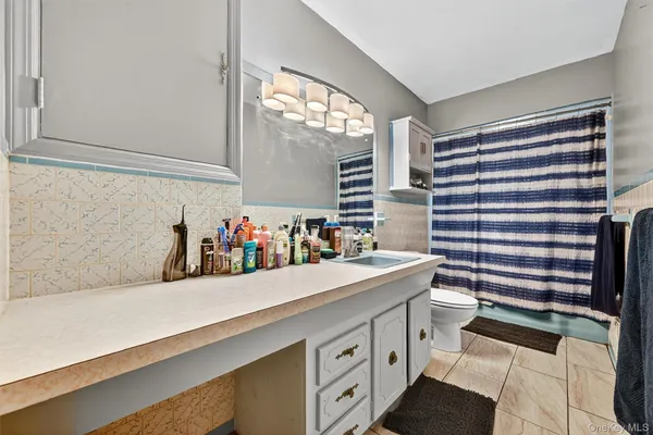 a kitchen with a sink and a refrigerator