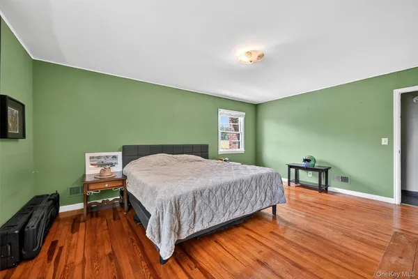 a bedroom with a bed and a table