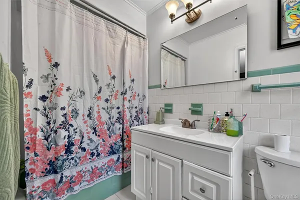 a kitchen with a sink and a refrigerator