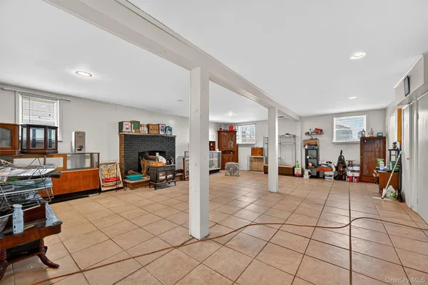 a view of a livingroom with lounge chair and a window