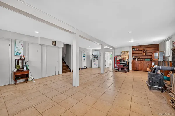 a view of a livingroom with workspace and a couch