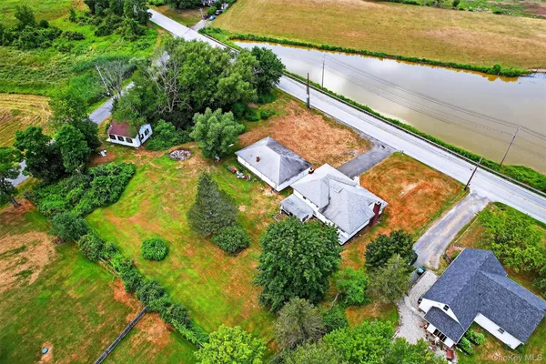 an aerial view of residential houses with outdoor space