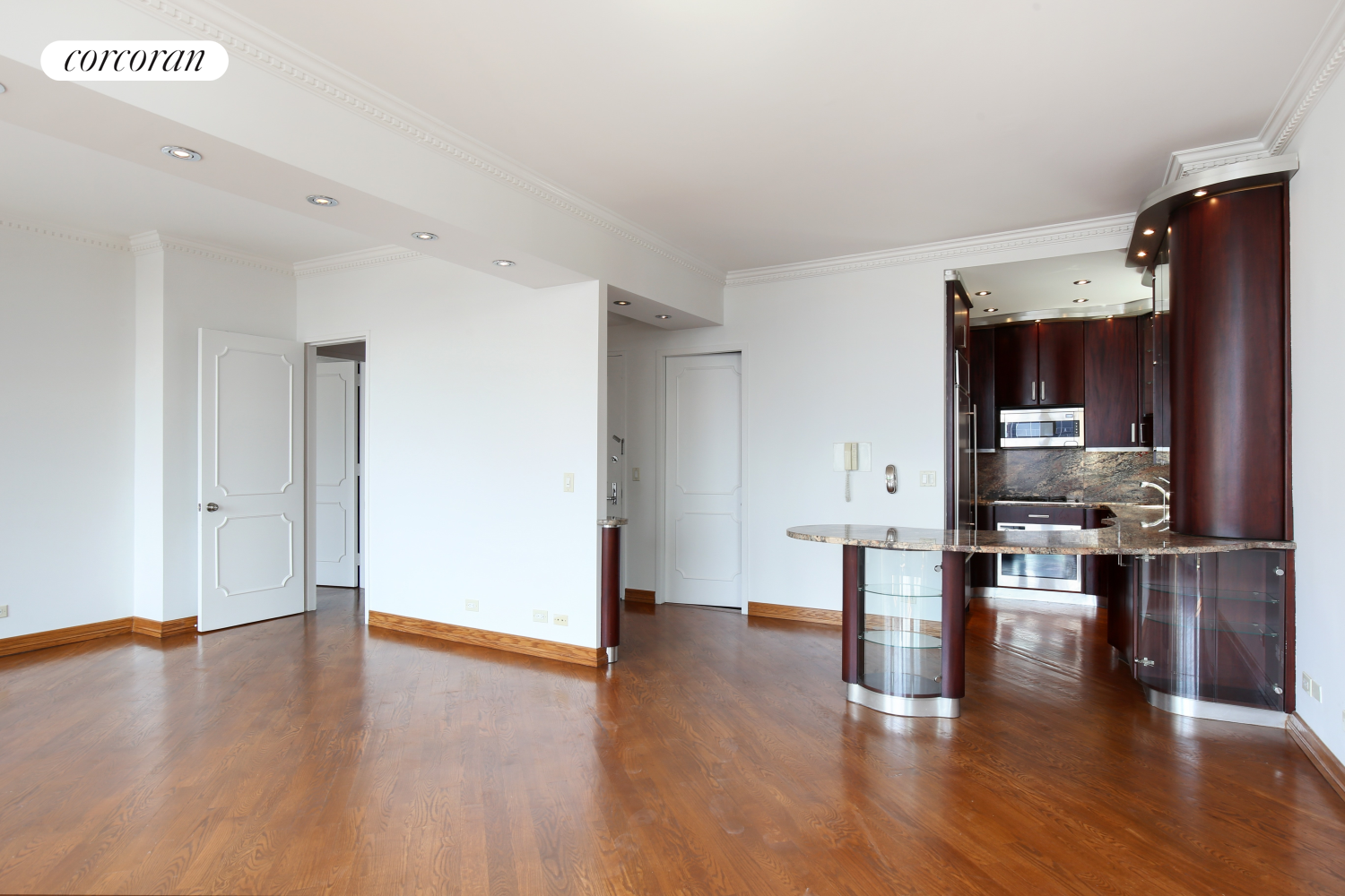 236 East 47th Street, Unit PH1A Manhattan, NY 10017 - Photo 6 of 9 a view of kitchen with furniture and wooden floor