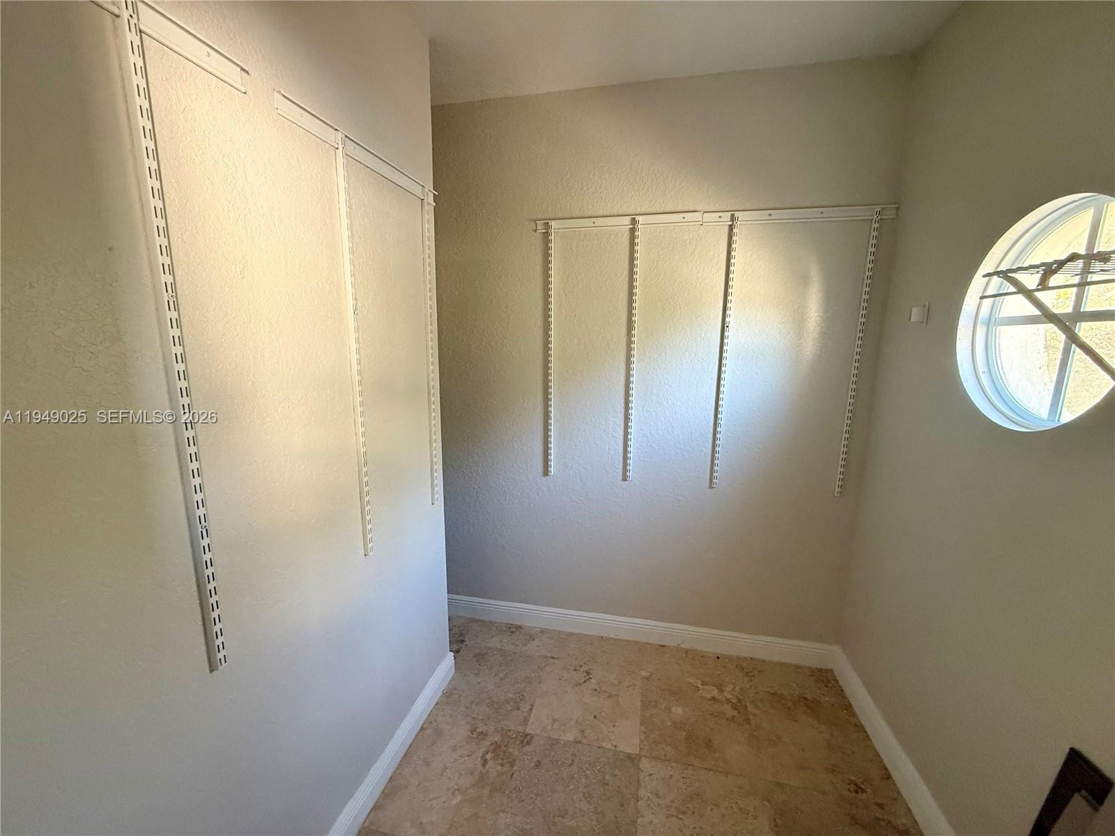 2511 Southwest 99th Way, Unit 2511 Miramar, FL 33025 - Photo 14 of 23 a view of an entryway with wooden floor