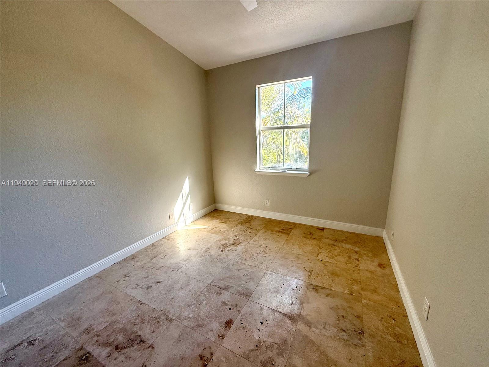 2511 Southwest 99th Way, Unit 2511 Miramar, FL 33025 - Photo 15 of 23 an empty room with a window