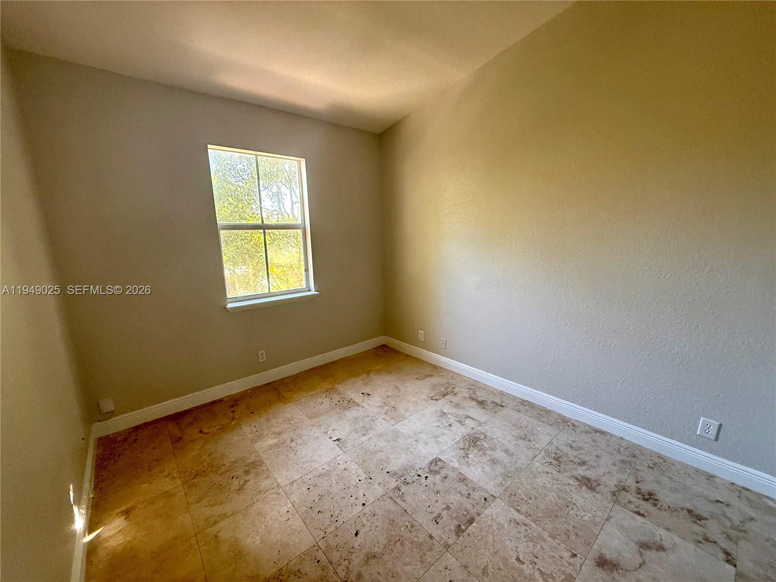 2511 Southwest 99th Way, Unit 2511 Miramar, FL 33025 - Photo 16 of 23 an empty room with a window