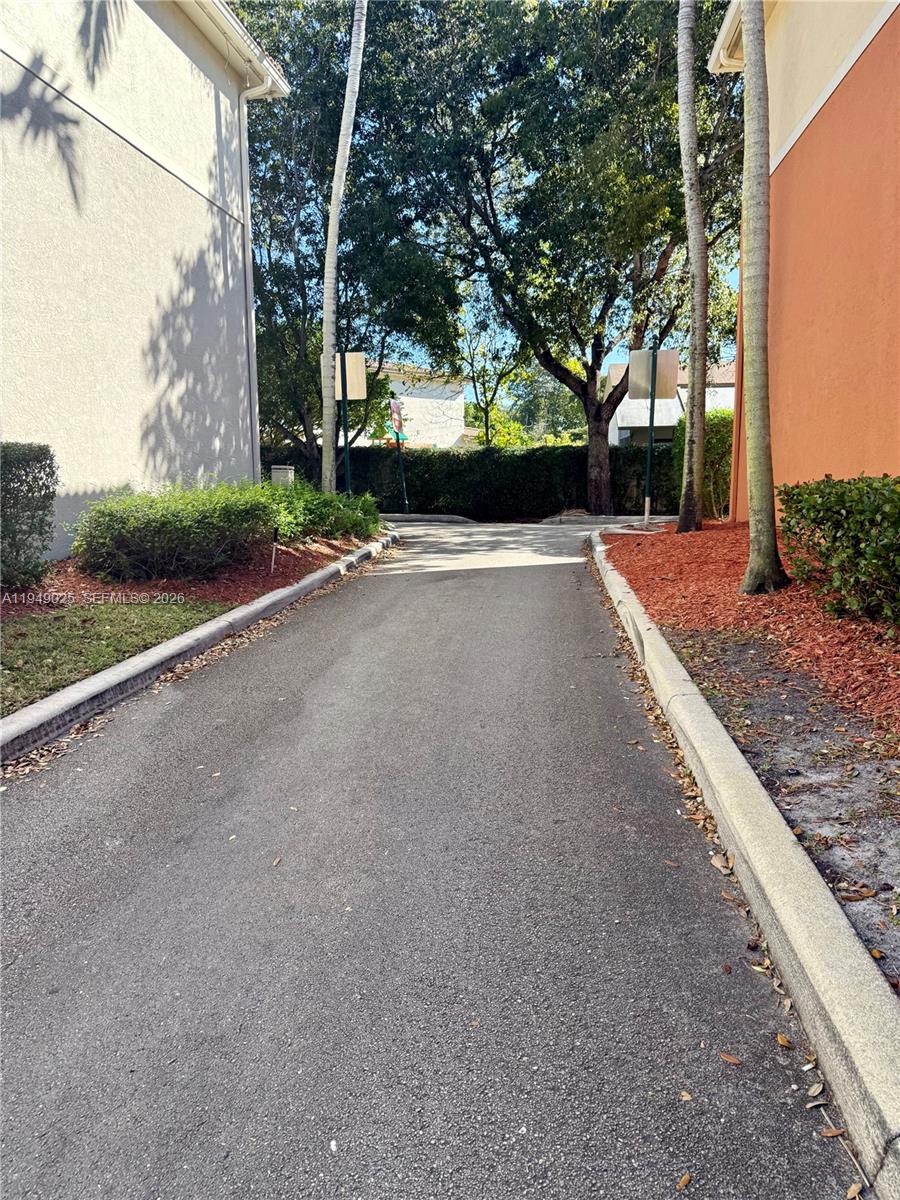 2511 Southwest 99th Way, Unit 2511 Miramar, FL 33025 - Photo 19 of 23 a view of a street with a large trees