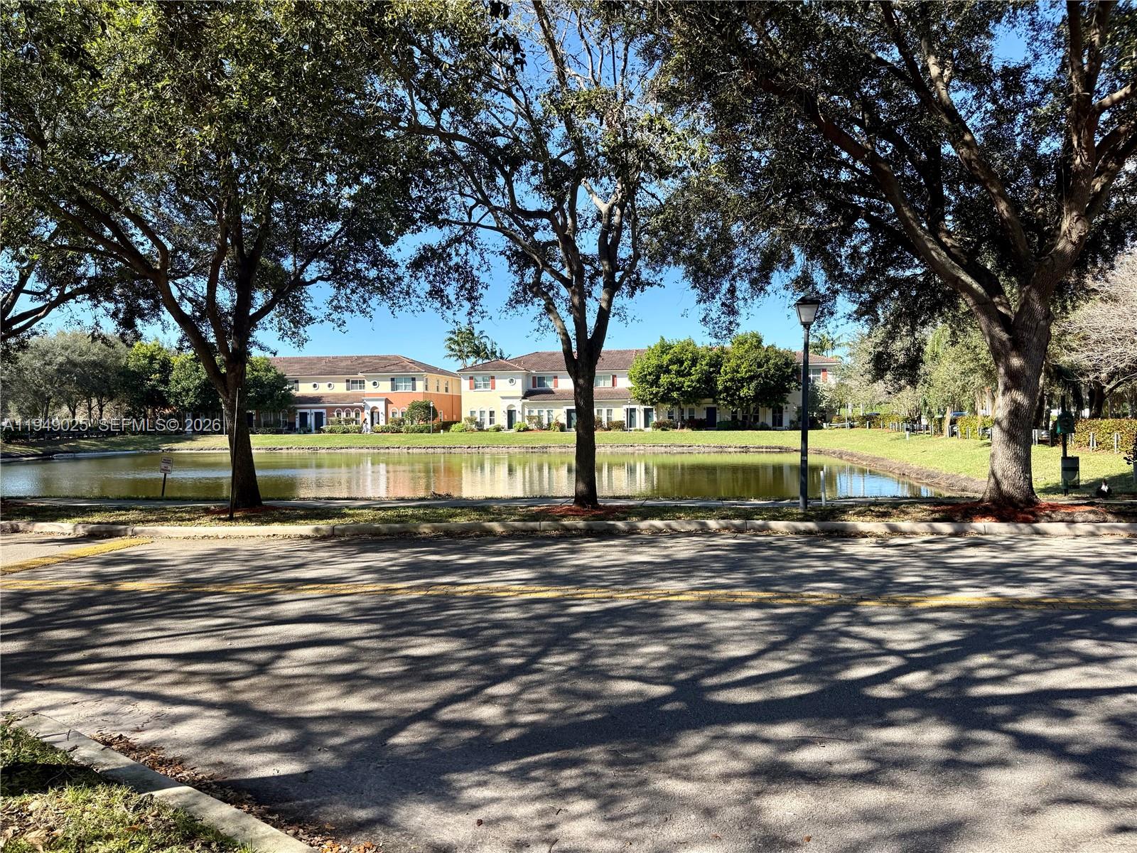 2511 Southwest 99th Way, Unit 2511 Miramar, FL 33025 - Photo 22 of 23 a view of a yard with plants and trees