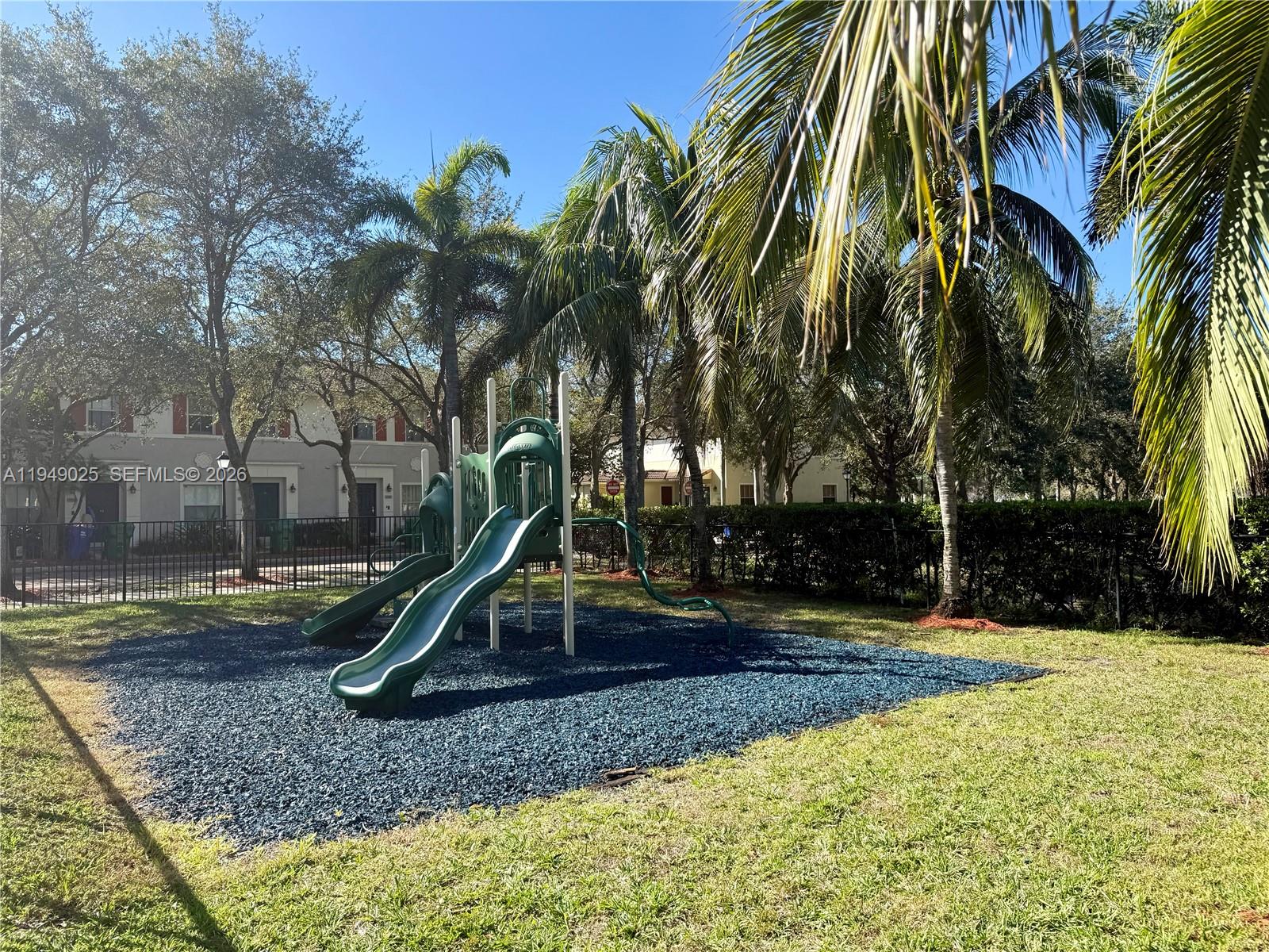 2511 Southwest 99th Way, Unit 2511 Miramar, FL 33025 - Photo 23 of 23 a view of a park with swings and slides