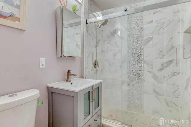 a bedroom with a bed and windows