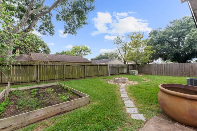 a view of a backyard with green space