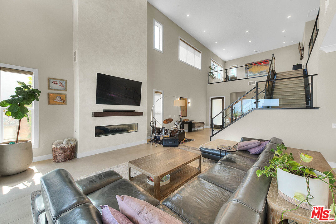 20558 Overlook Court Porter Ranch, CA 91326 - Photo 6 of 48 a living room with furniture and a flat screen tv