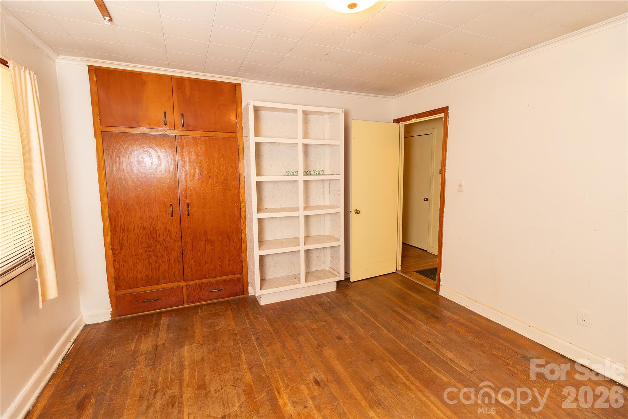 609 Wilcox Avenue Gaffney, SC 29341 - Photo 19 of 23 a view of an empty room with cabinet and a window
