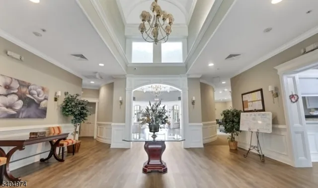 a view of a livingroom with furniture window and wooden floor