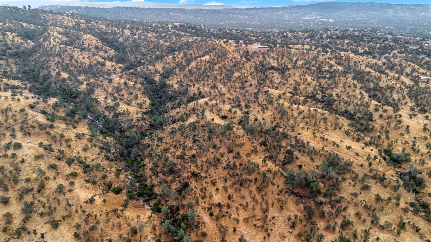 37749 Misty Ridge Road Raymond, CA 93653 - Photo 19 of 23 an aerial view of house with yard and mountain view in back