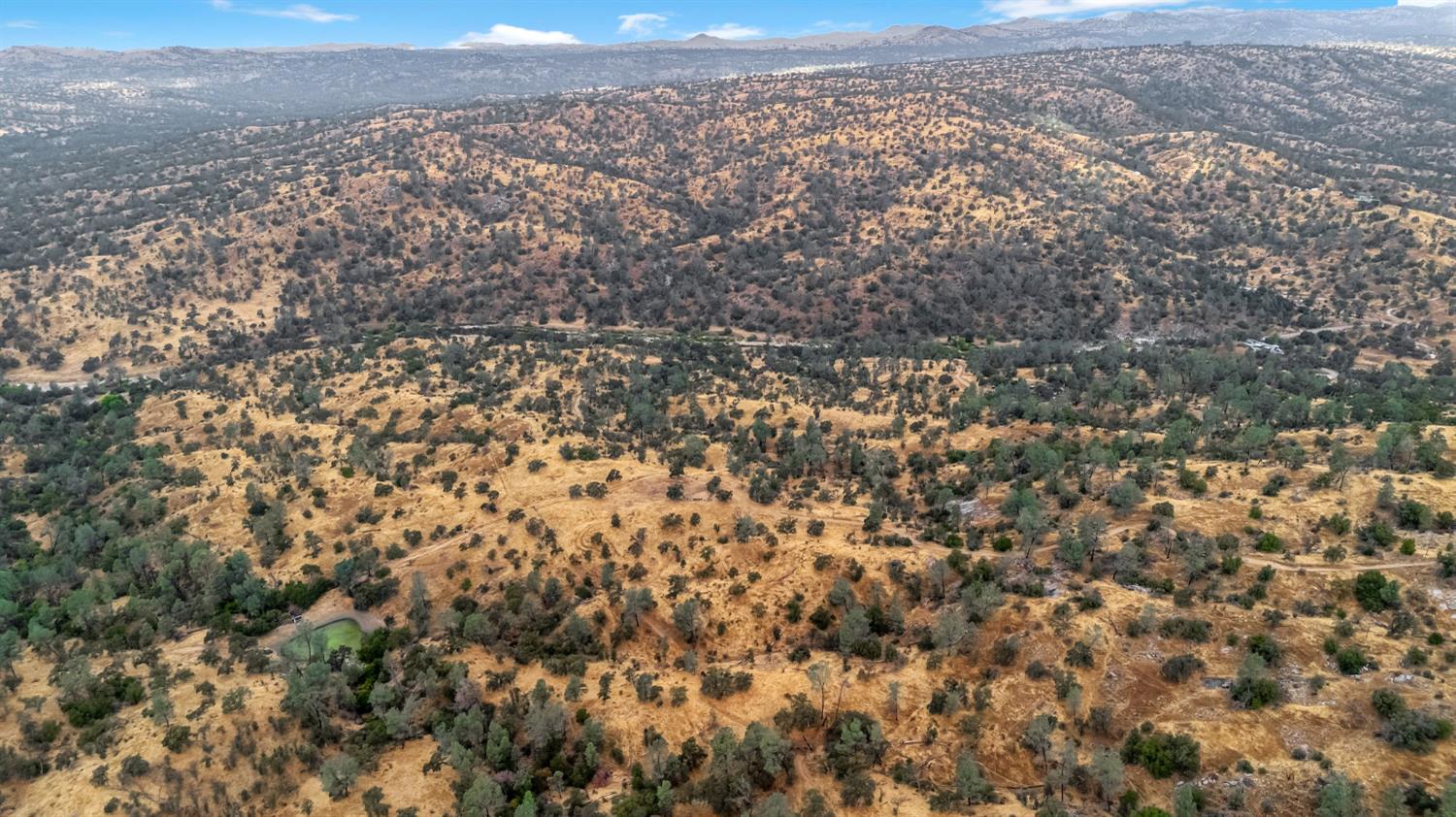 37749 Misty Ridge Road Raymond, CA 93653 - Photo 22 of 23 an aerial view of house with yard and mountain view in back