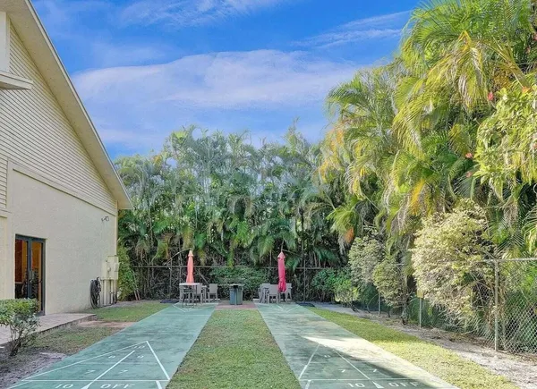 a view of a swimming pool with a patio