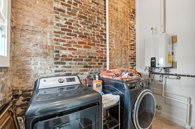a bedroom with a bed and a fireplace