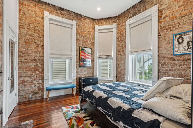 a open kitchen with stainless steel appliances granite countertop a sink and cabinets with wooden floor