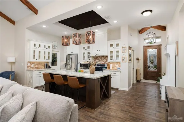 an aerial view of a swimming pool a fireplace and yard