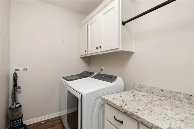 a kitchen with stainless steel appliances granite countertop a sink and a refrigerator