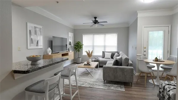 a living room with furniture and a flat screen tv