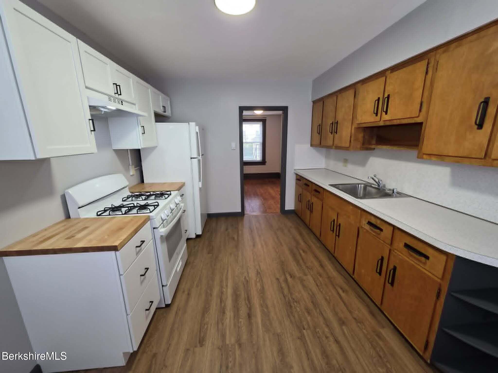 40 East Jordan Street, Unit 1 Adams, MA 01220 - Photo 2 of 12 a kitchen with stainless steel appliances granite countertop a stove a sink dishwasher and a refrigerator