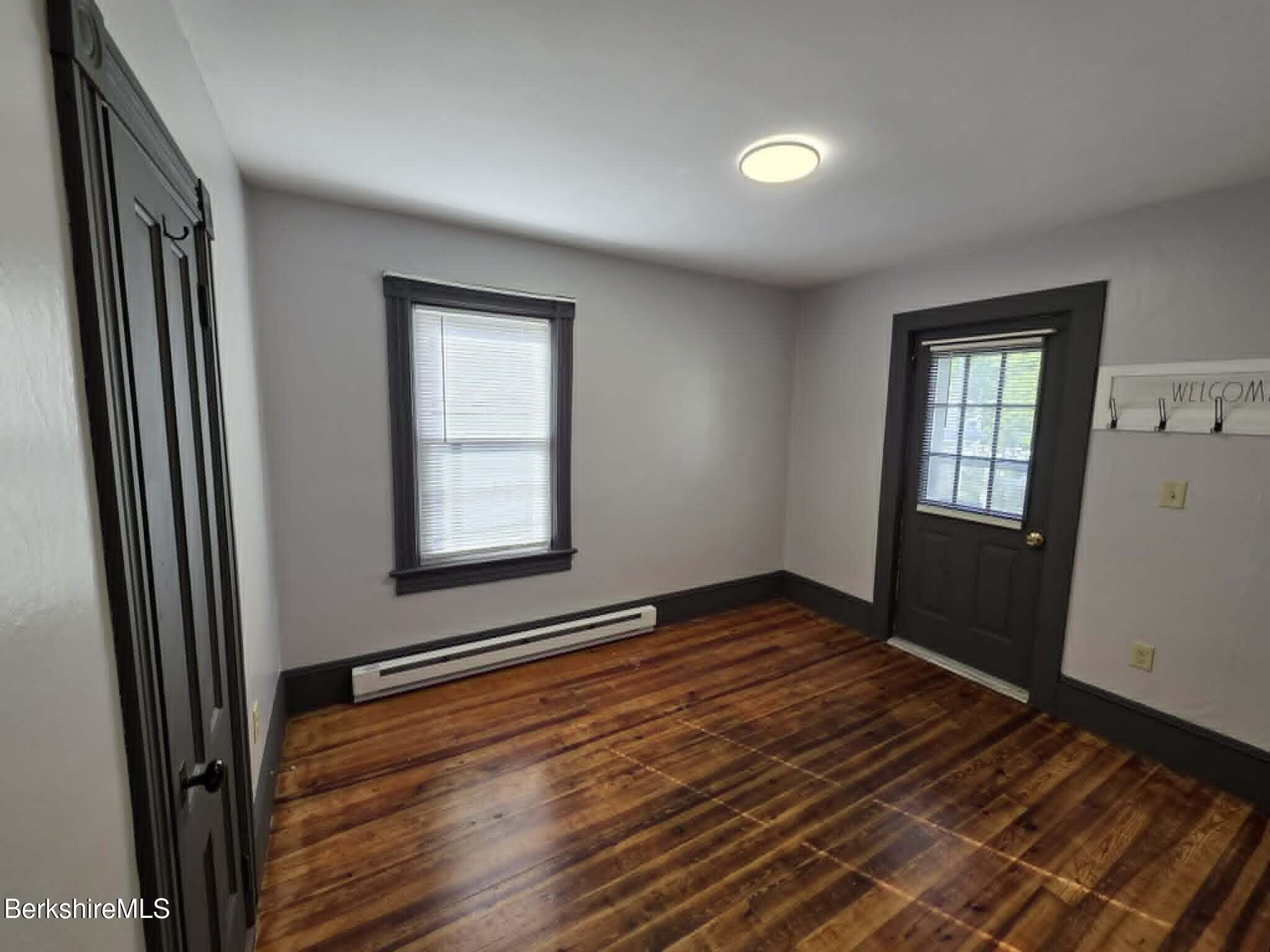 40 East Jordan Street, Unit 1 Adams, MA 01220 - Photo 7 of 12 a view of an empty room with wooden floor and a window