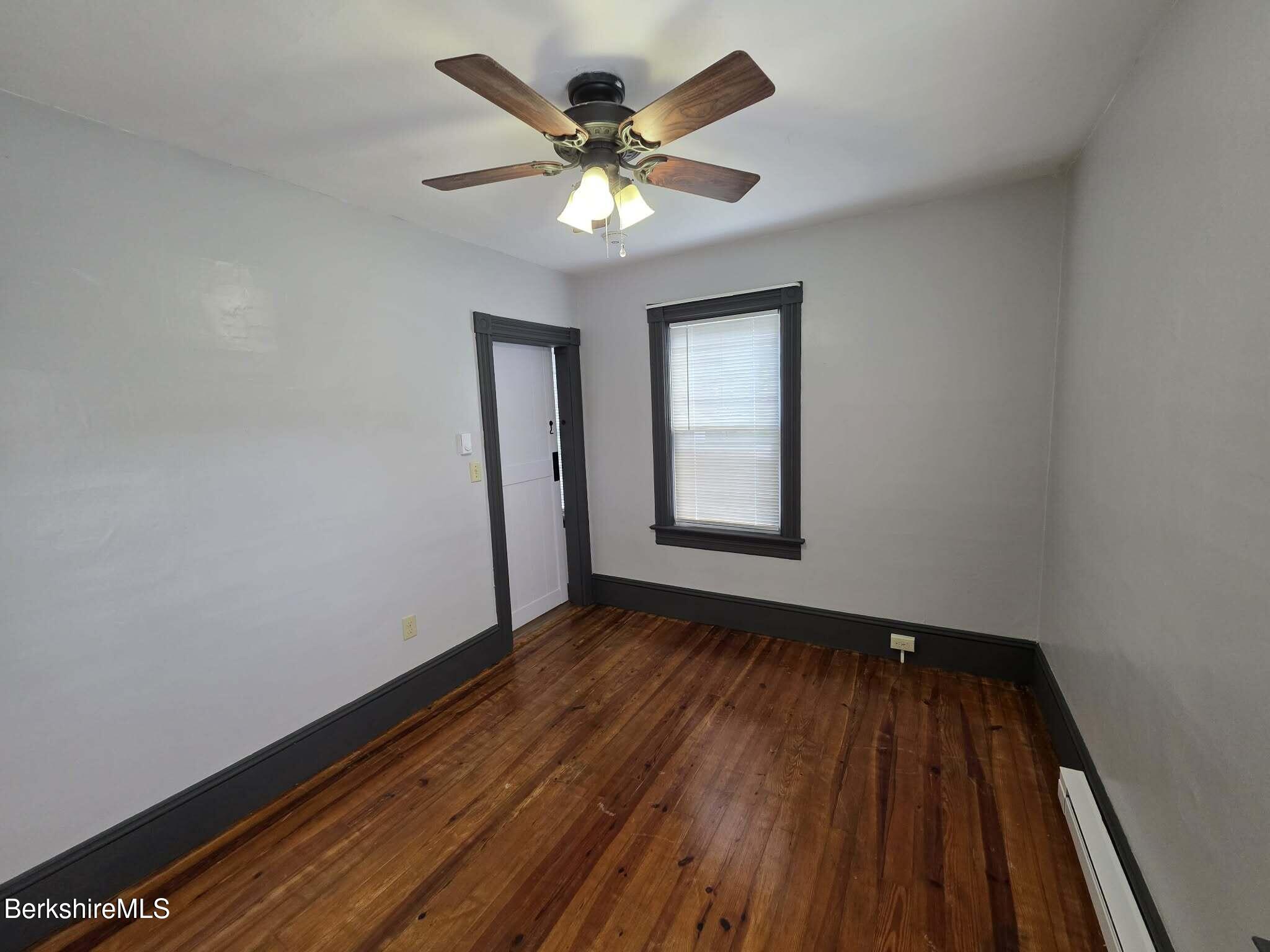 40 East Jordan Street, Unit 1 Adams, MA 01220 - Photo 8 of 12 wooden floor in an empty room with a window