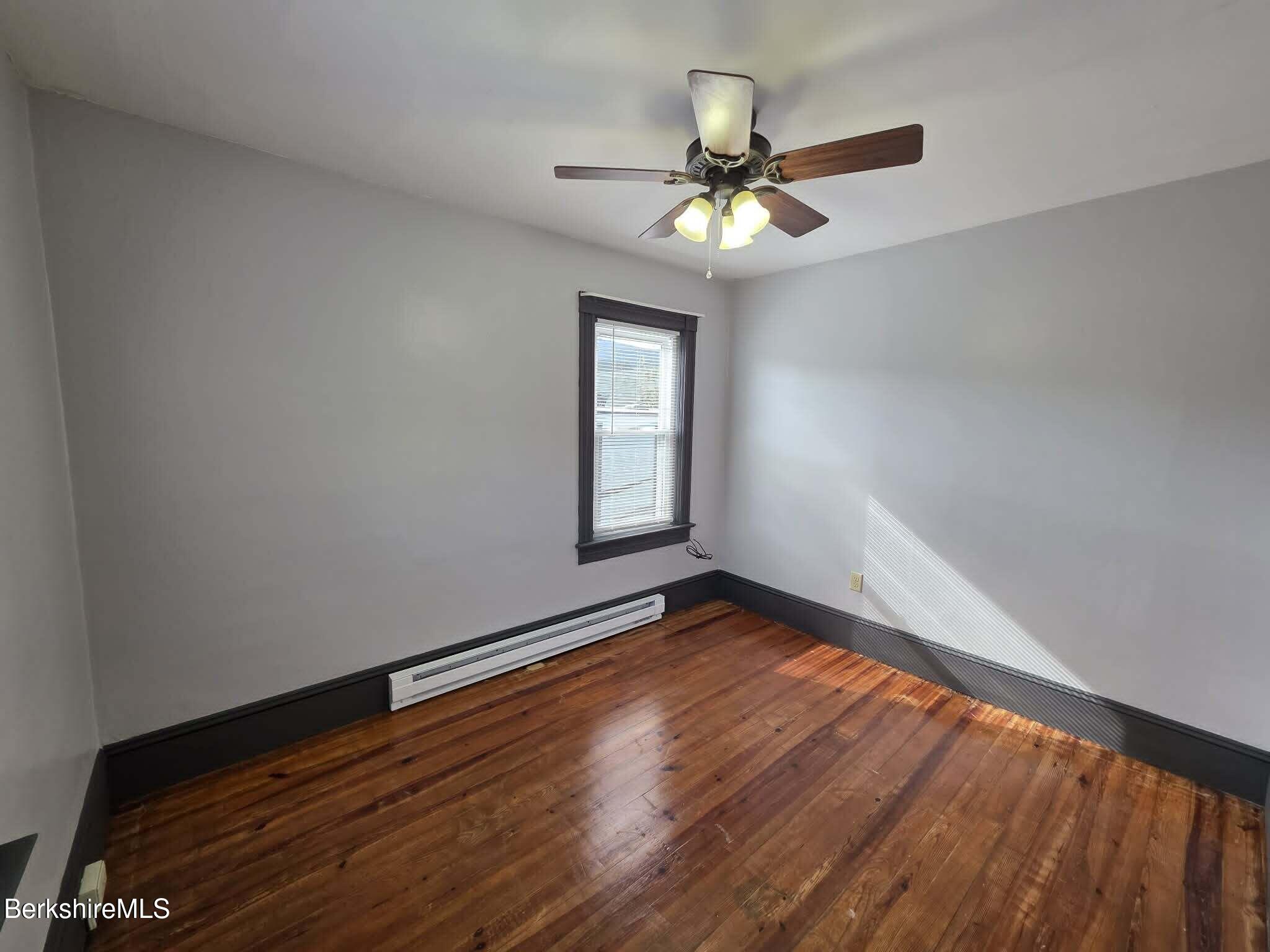 40 East Jordan Street, Unit 1 Adams, MA 01220 - Photo 9 of 12 a view of an empty room with wooden floor and a window