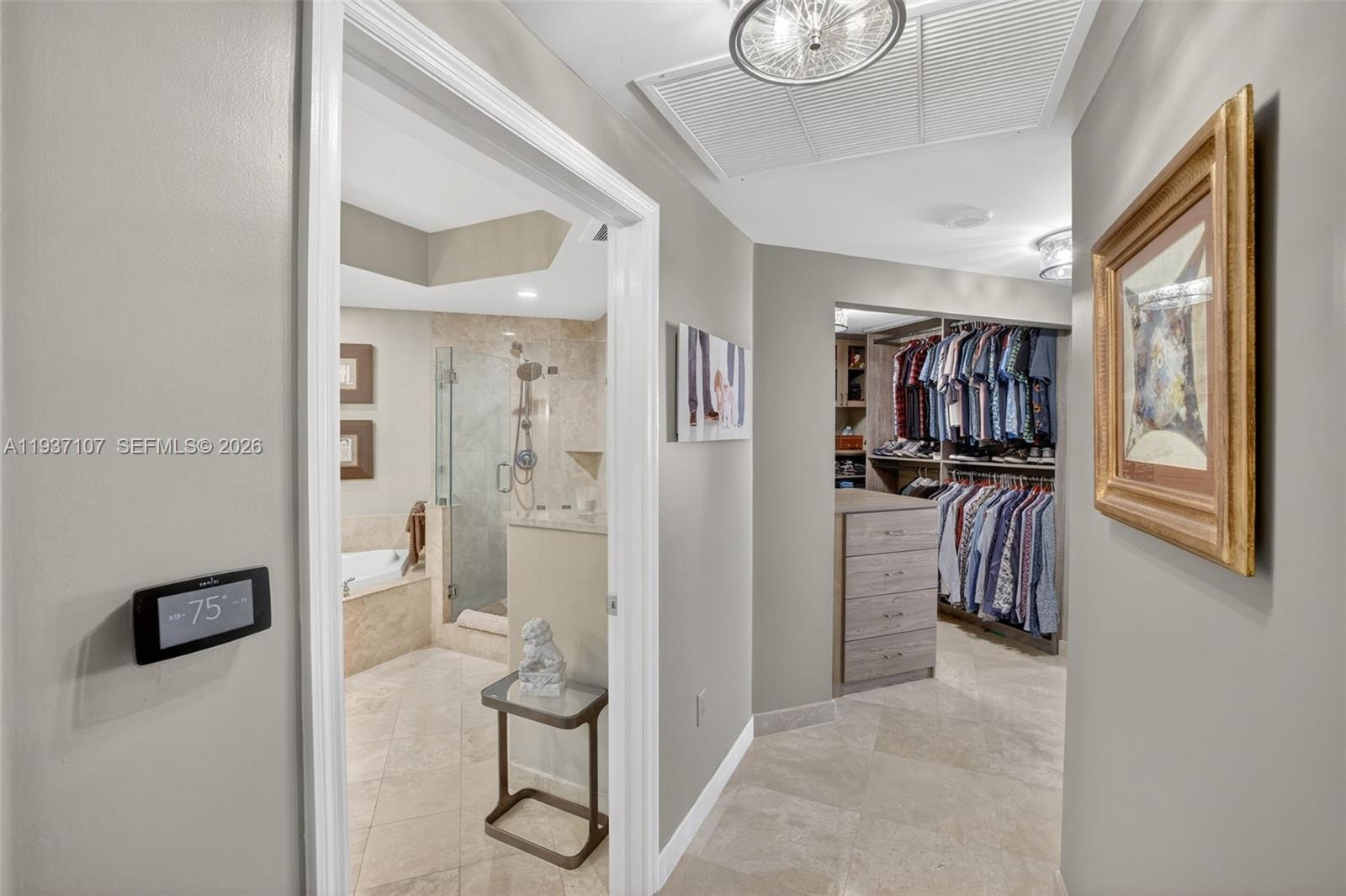 100 South Birch Road, Unit 1103F Fort Lauderdale, FL 33316 - Photo 35 of 80 View toward primary closet and bathroom. Wifi thermostat.