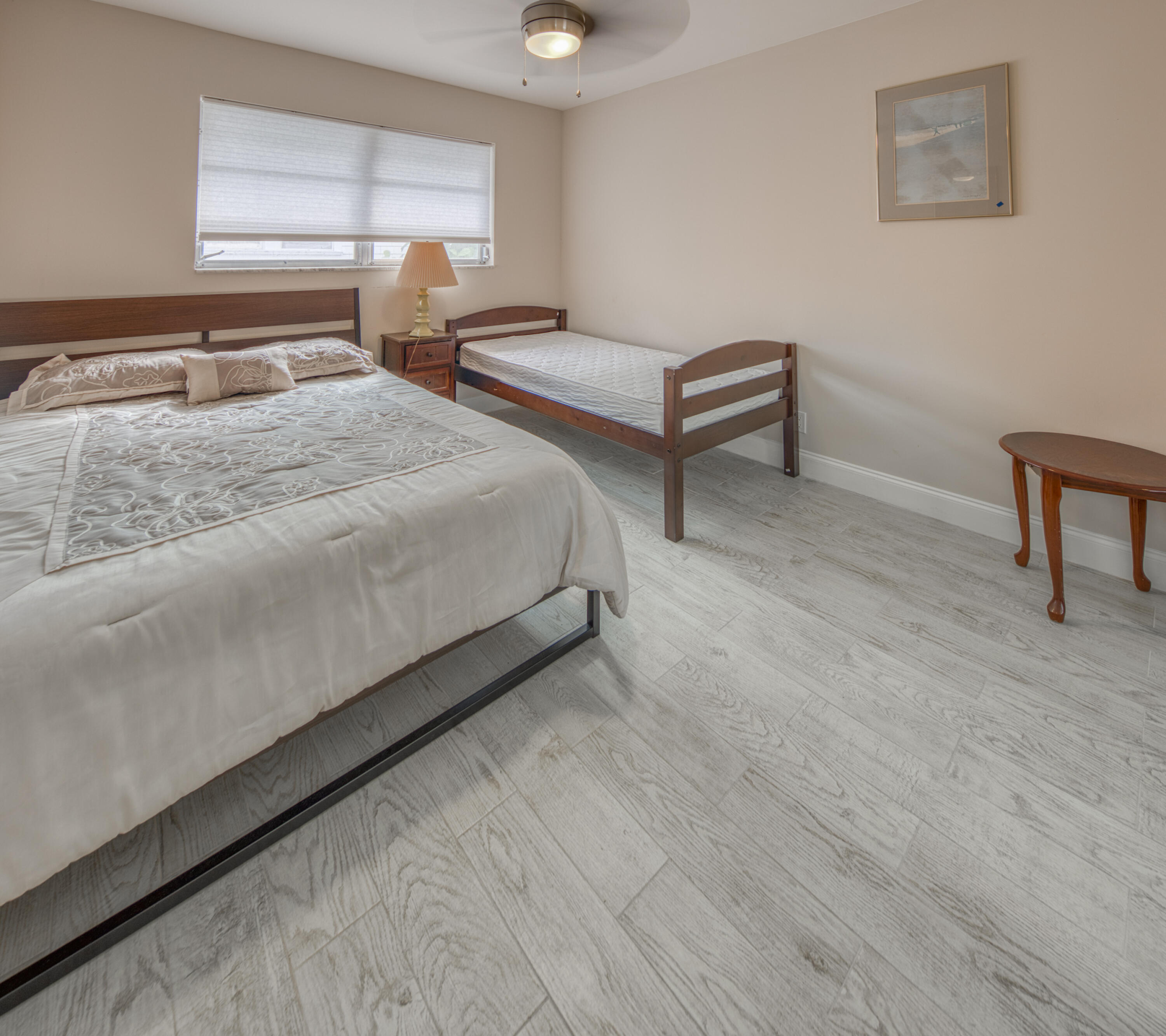 301 South Lakeside Drive, Unit 7 Lake Worth Beach, FL 33460 - Photo 12 of 15 a bedroom with a bed and a window